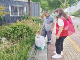 谢营科技大厦网格室开展“清洁家园 美化环境”志愿服务活动