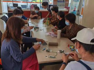 日照银行济南自贸区支行：粽情端午，巧制荷包，为新市民送上“家”的温情