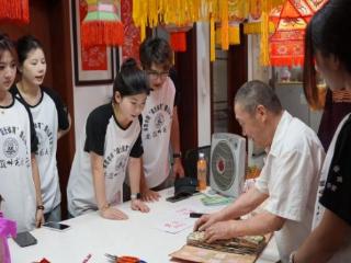 童心剪韵 纸生繁花——八旬剪纸匠人洪诗成携安徽师大支教团共谱传承新章