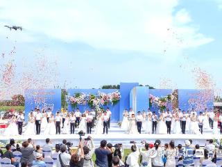 24对新人情定山海间！烟台市举办移风易俗主题集体婚礼