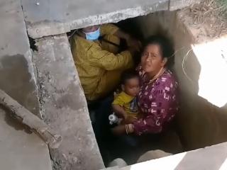 柬泰冲突持续炮火密集 边境居民抱婴儿藏在排水沟躲避战火