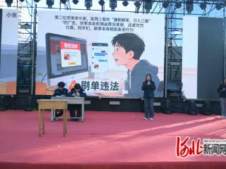 新华集贸市场治安派出所“春风化雨”义警宣传队亮相湾里庙