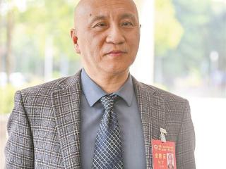 市政协委员杨军：形成“转角遇见书”的城市风景