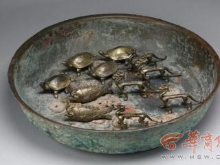 棺椁下腰坑铜盆内放置鎏金龙、龟、鱼及铜钱 唐康令恽墓出土遗物为何如此神秘？